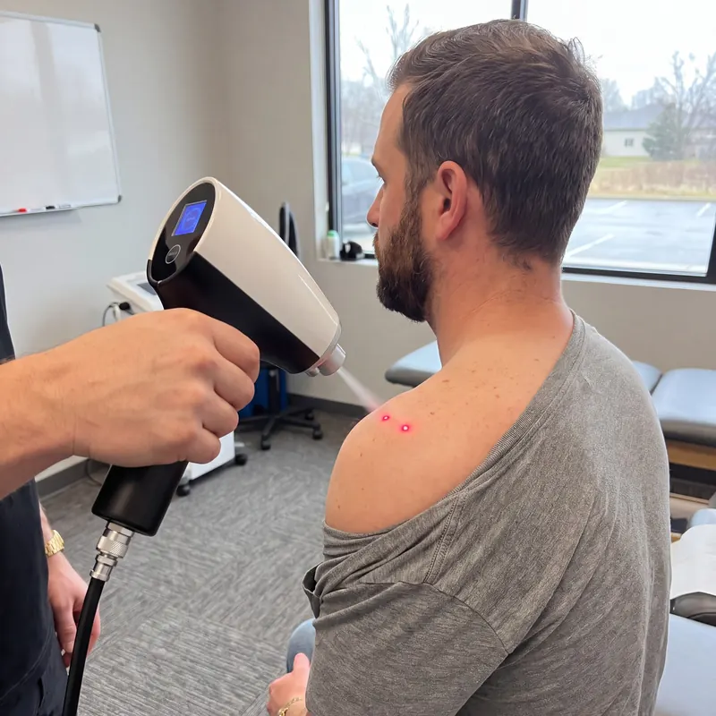 Treating a patient's shoulder in a PT clinic